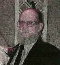 His grandfather had a beard, glasses and bald head.